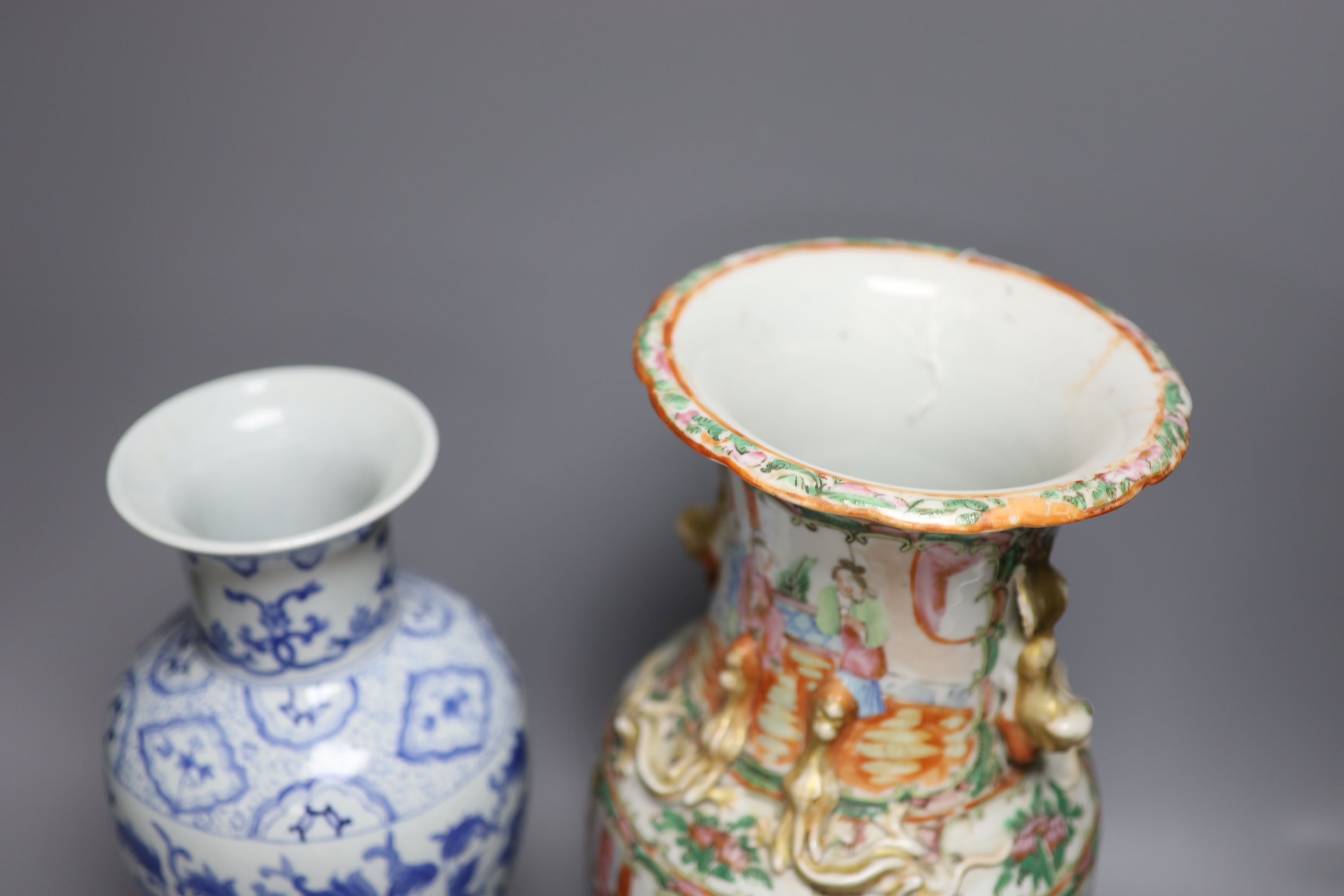 A Chinese famille rose Canton vase, a pair of blue and white vases and two others, tallest 35.5cm